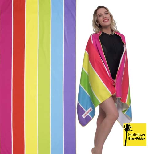 A photo of a woman enjoying her new beach towel black friday deal.