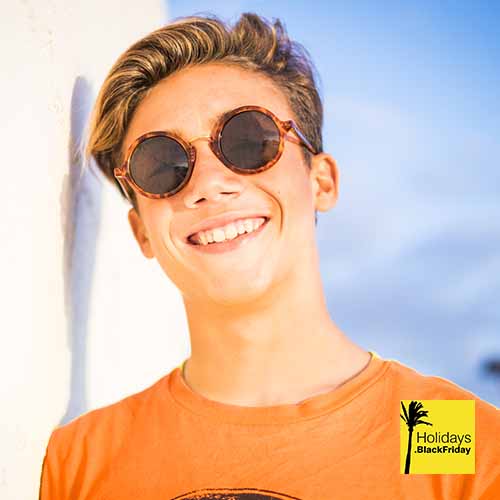 A photograph of a boy wearing sunglasses from holidays black friday deals site.